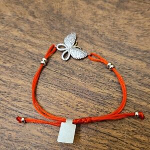 NWT Bracelet red pull string with clear Silver butterfly
